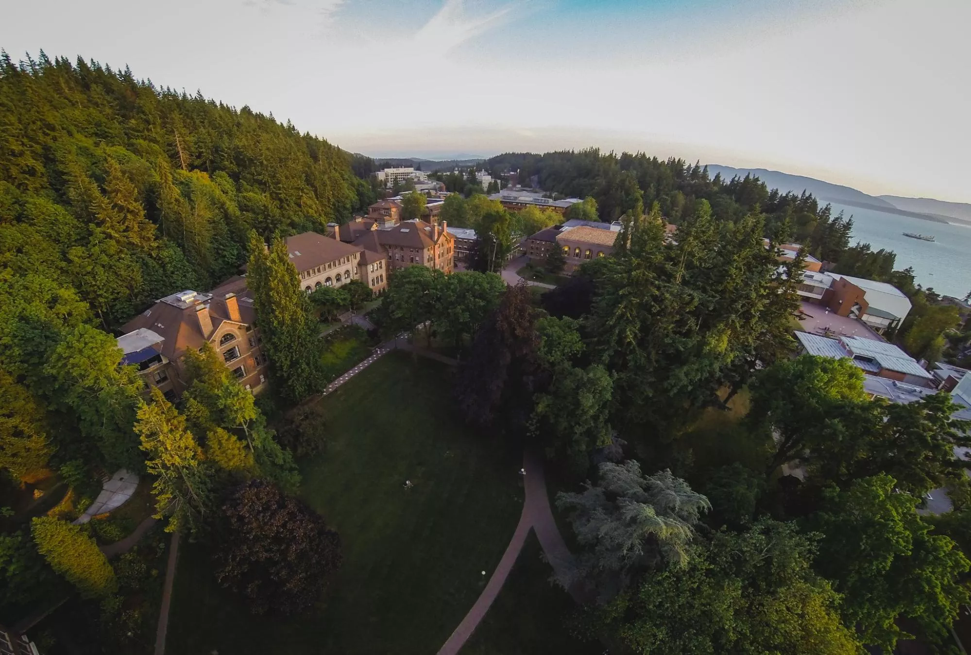 Aerial view of Western's campus, nestled between a tree covered arboretum and Bellingham Bay