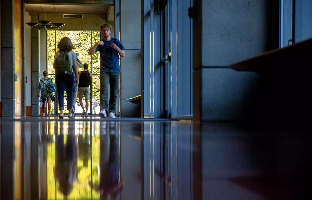 Students walking in a hallway in the science lecture building