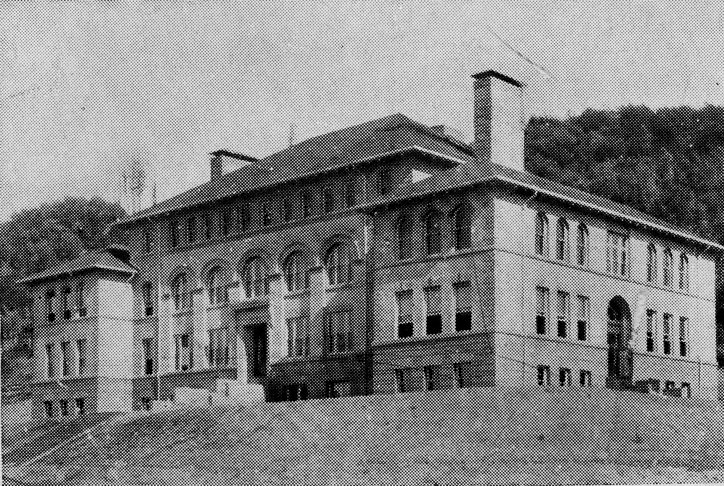 Black and white photo of Old Main, a brick building.