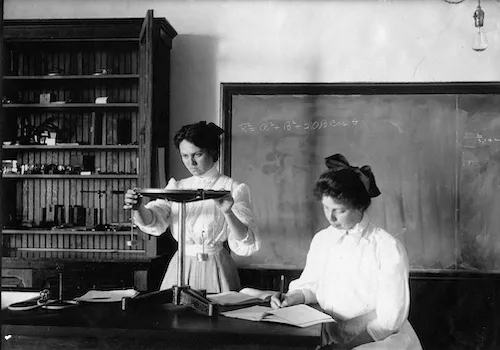 Two young women students in a science lab in 1904